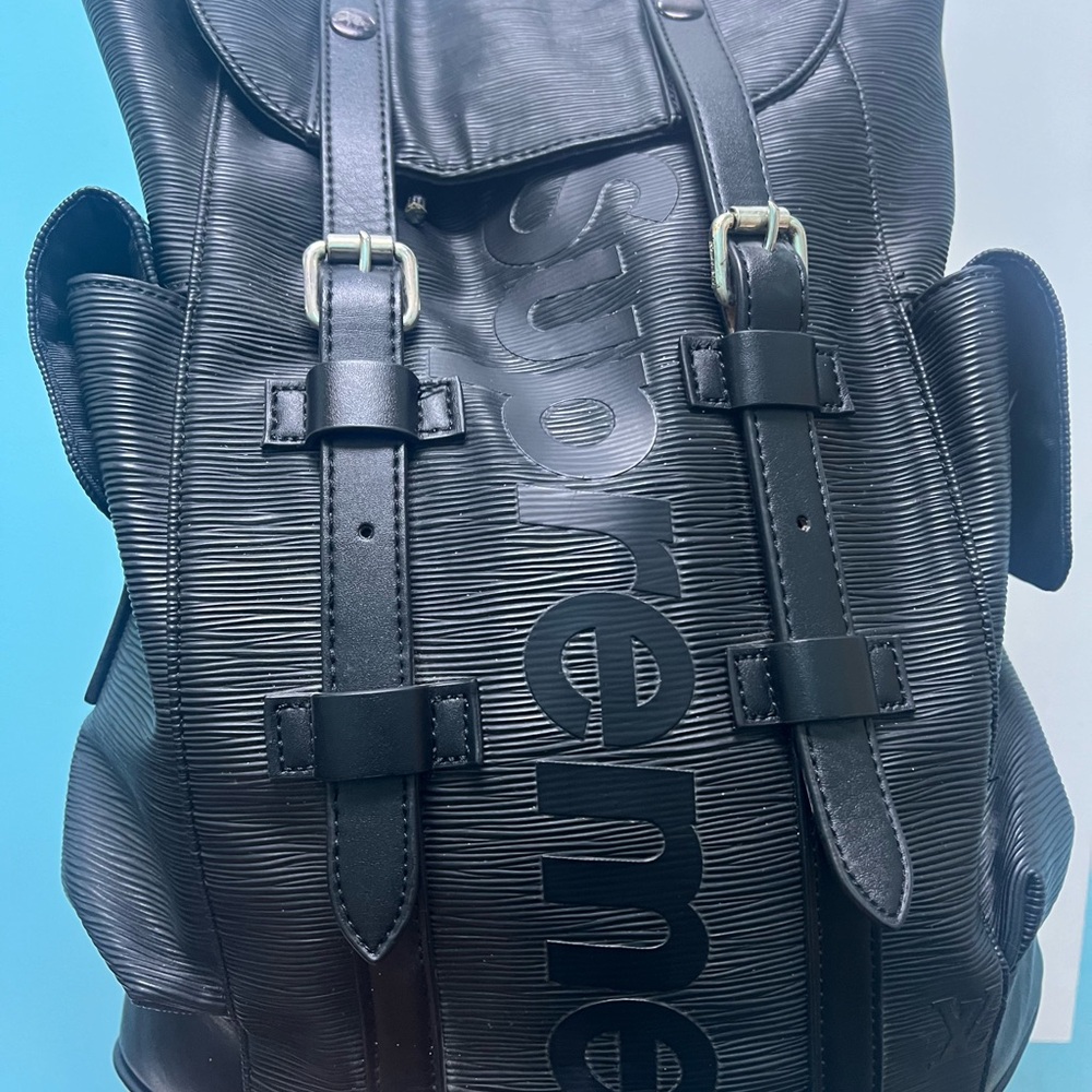 Supreme Black Textured Leather Logo Backpack with Buckle Straps